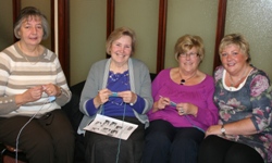 Edna Purdy, Shirley Wilson and Isobel Bickerstaffe get a lesson in crochet from tutor Judy Magee, right.